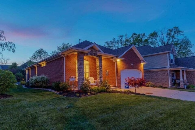 view of front of house with a yard and a garage