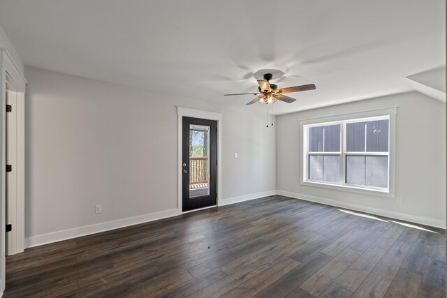 empty room featuring ceiling fan and dark hardwood / wood-style floors