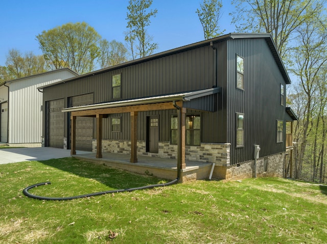 exterior space with a garage and a lawn