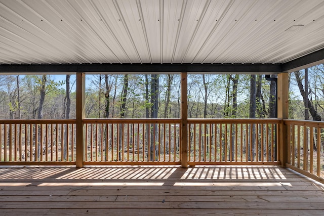 unfurnished sunroom with a wealth of natural light