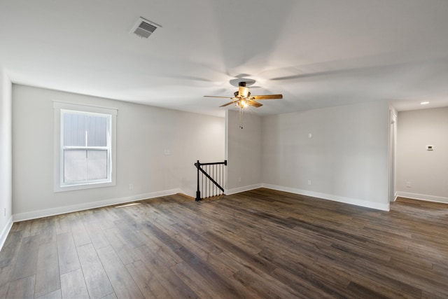 unfurnished room featuring dark hardwood / wood-style flooring and ceiling fan