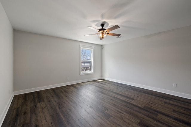 unfurnished room with ceiling fan and dark wood-type flooring