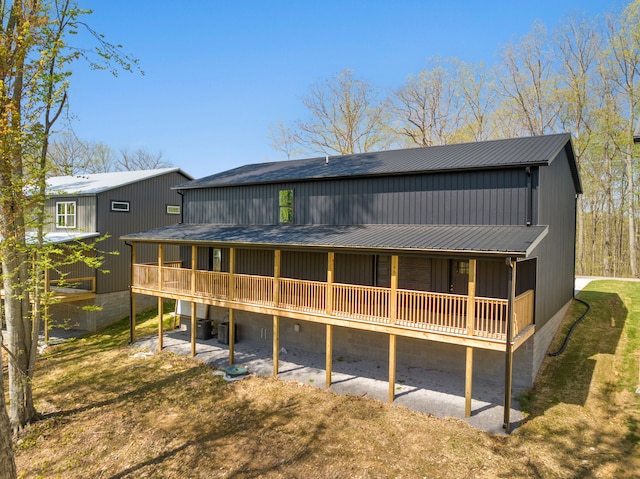 rear view of house featuring a yard and central AC