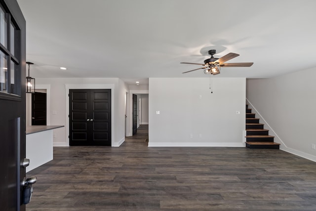 interior space featuring dark hardwood / wood-style flooring and ceiling fan