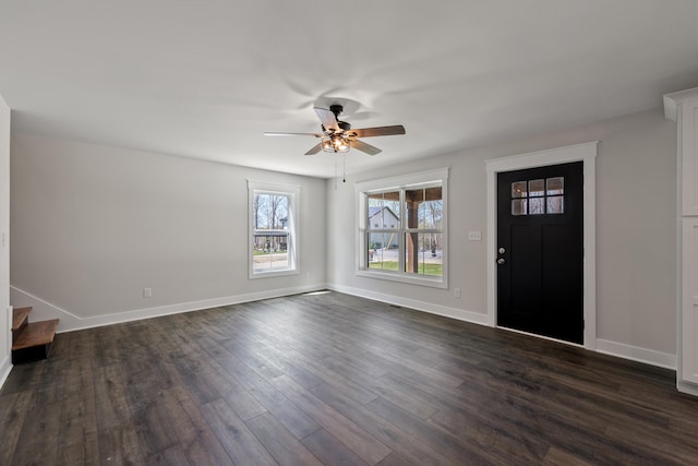 entrance foyer with dark hardwood / wood-style flooring and ceiling fan