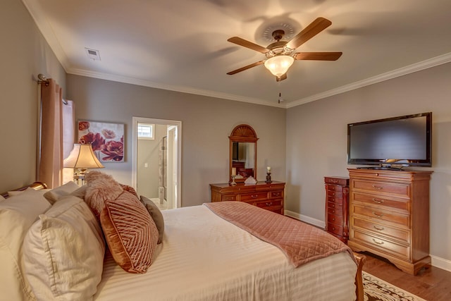 bedroom with ornamental molding, connected bathroom, ceiling fan, and hardwood / wood-style flooring