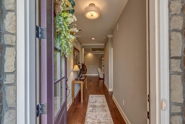 hallway with crown molding and dark hardwood / wood-style floors