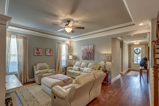 living room with ornamental molding, plenty of natural light, wood-type flooring, and ceiling fan