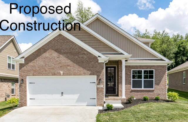 craftsman inspired home featuring a garage and a front lawn