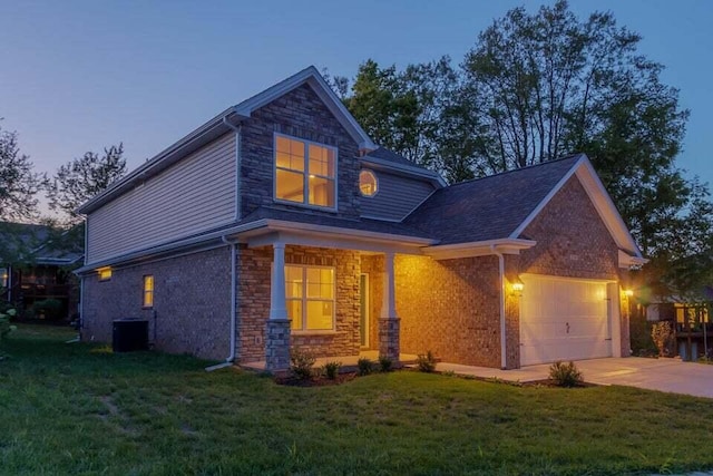 craftsman inspired home featuring central AC unit and a lawn