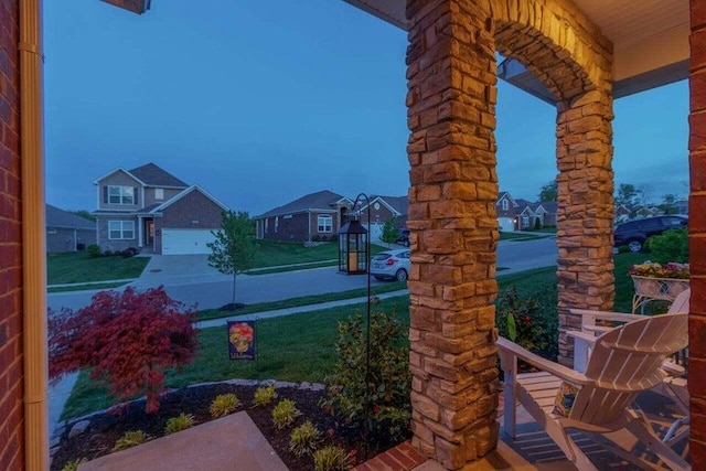 yard at dusk with a garage