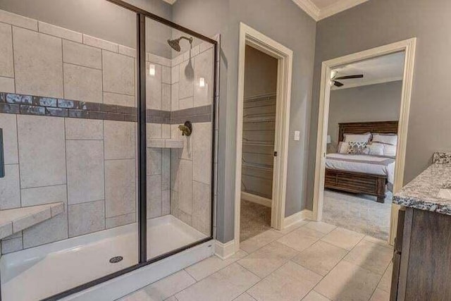 bathroom with ornamental molding, walk in shower, vanity, and tile floors