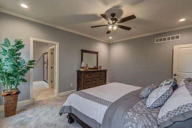 carpeted bedroom with ornamental molding and ceiling fan