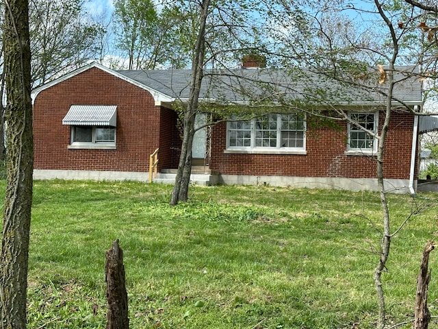 256 Carrick Pike, Georgetown, KY 40324 - view of front facade featuring a front lawn, brick siding, and a chimney
