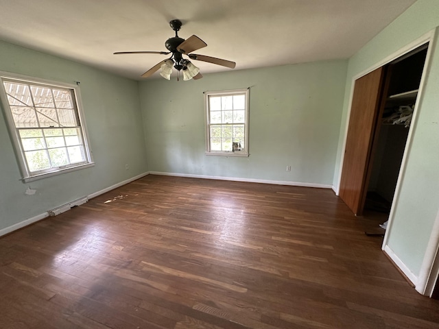 256 Carrick Pike, Georgetown, KY 40324 - unfurnished bedroom with dark wood-style flooring, a closet, baseboards, and a ceiling fan