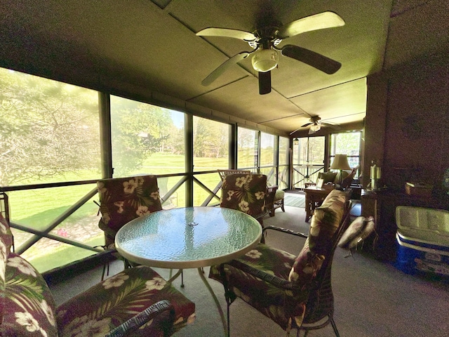 sunroom / solarium featuring ceiling fan