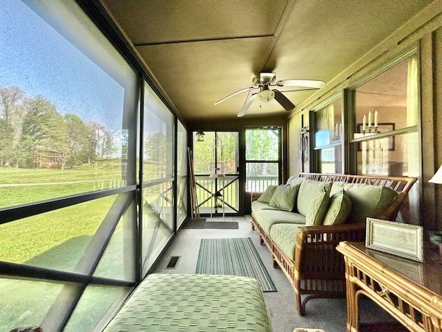 sunroom / solarium with ceiling fan