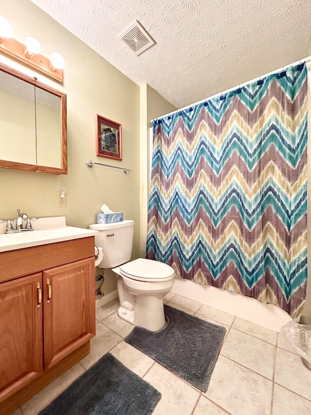 full bathroom with a textured ceiling, shower / bath combination with curtain, toilet, tile floors, and vanity