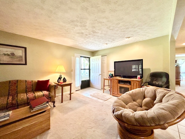 tiled living room featuring a textured ceiling