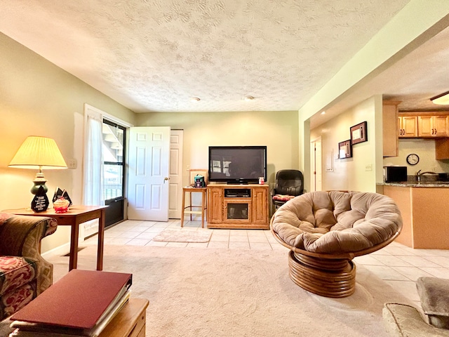 carpeted living room featuring a textured ceiling