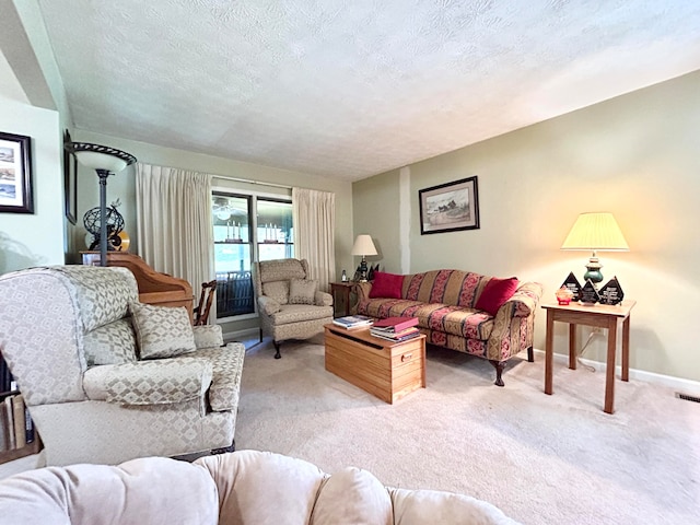 carpeted living room featuring a textured ceiling