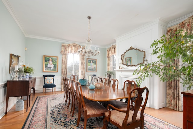 511 Boone Ave, Winchester, KY 40391 - dining space with baseboard heating, light hardwood / wood-style floors, a chandelier, and crown molding