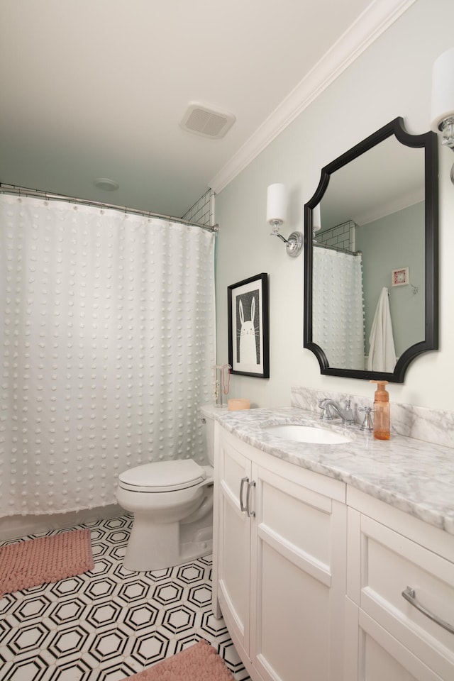 511 Boone Ave, Winchester, KY 40391 - bathroom featuring ornamental molding, tile floors, vanity, and toilet