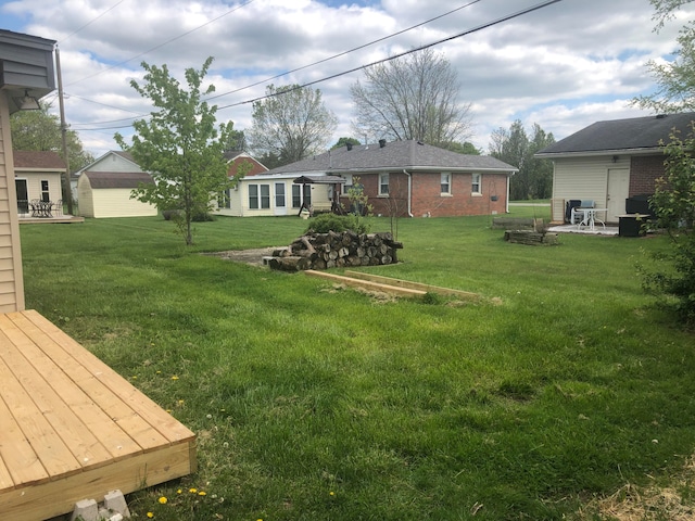 view of yard with a patio and an outdoor structure