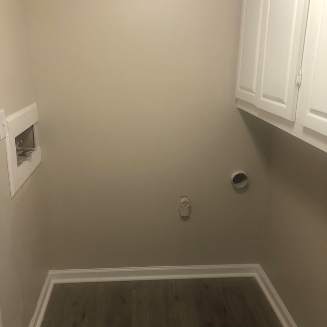 laundry room with washer hookup, cabinets, and light wood-type flooring