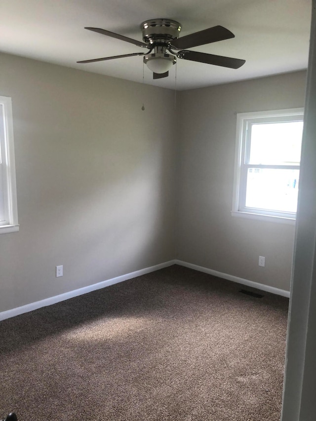 carpeted empty room with ceiling fan