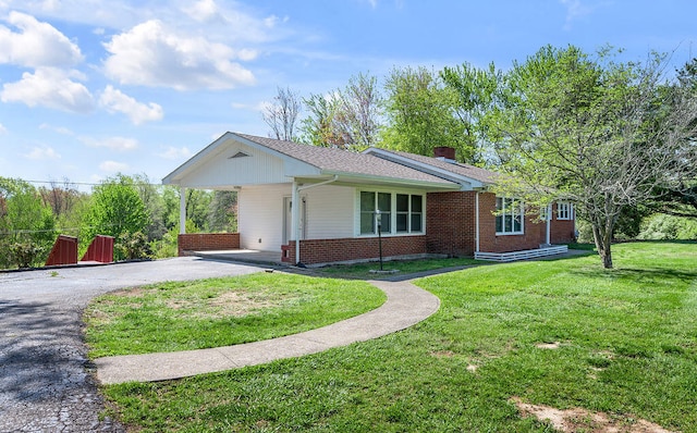 ranch-style home with a front yard