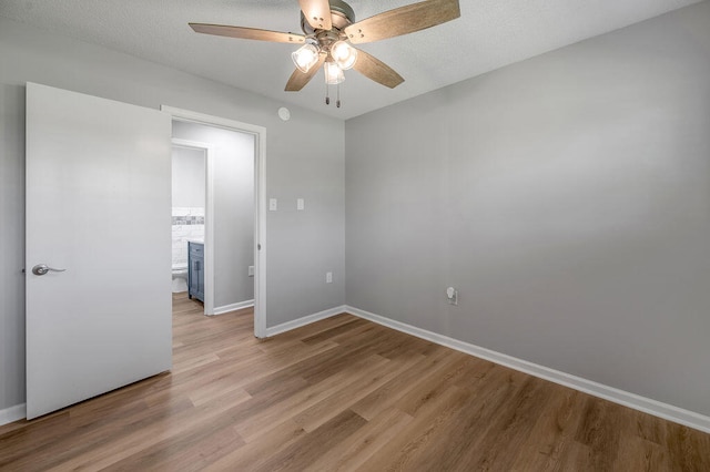 unfurnished room featuring ceiling fan and light wood-type flooring