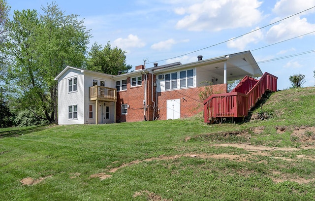 rear view of house with a lawn