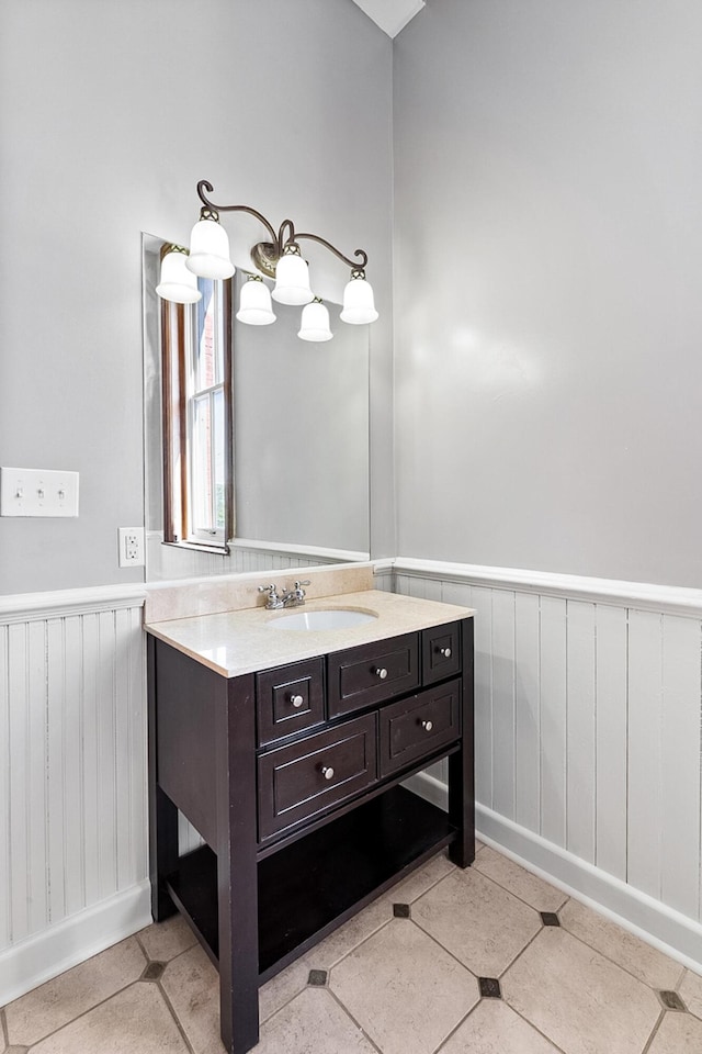 bathroom with tile floors and vanity