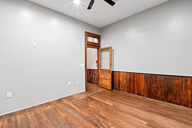 spare room featuring hardwood / wood-style flooring and ceiling fan