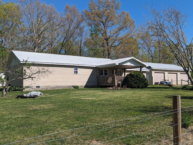 view of front facade with a garage and a front lawn