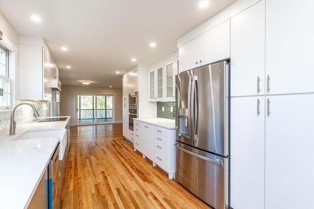 spacious closet with hardwood / wood-style floors