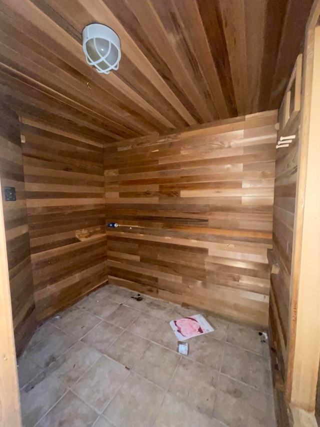 view of sauna featuring wood walls