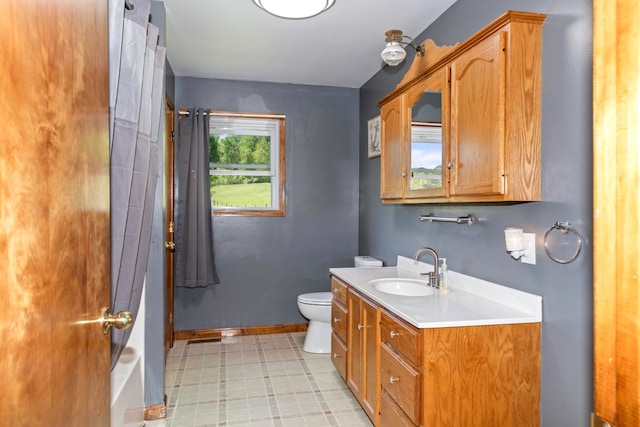 bathroom featuring vanity, a shower with curtain, and toilet