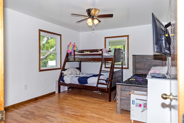 bedroom featuring light wood-type flooring and ceiling fan