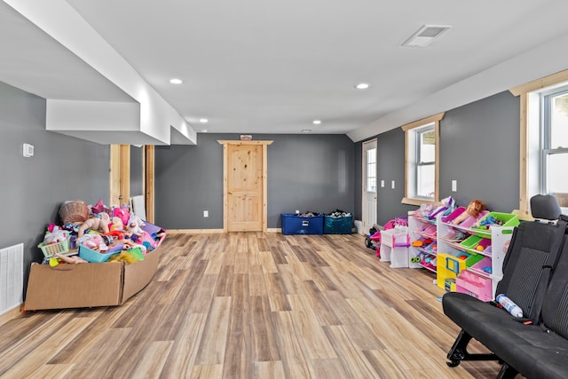 rec room with light wood-type flooring