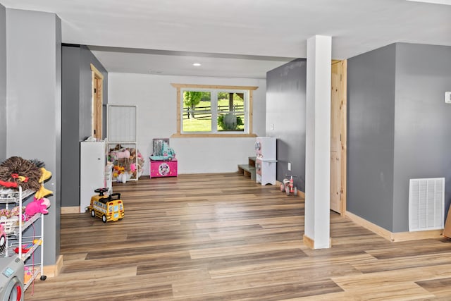 playroom with wood-type flooring