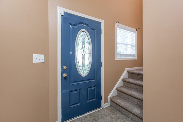 tiled foyer with plenty of natural light