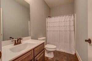 bathroom featuring vanity and toilet