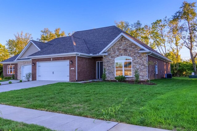 single story home featuring a garage, central air condition unit, and a front yard