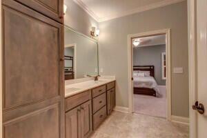 bathroom featuring dual vanity and tile patterned floors