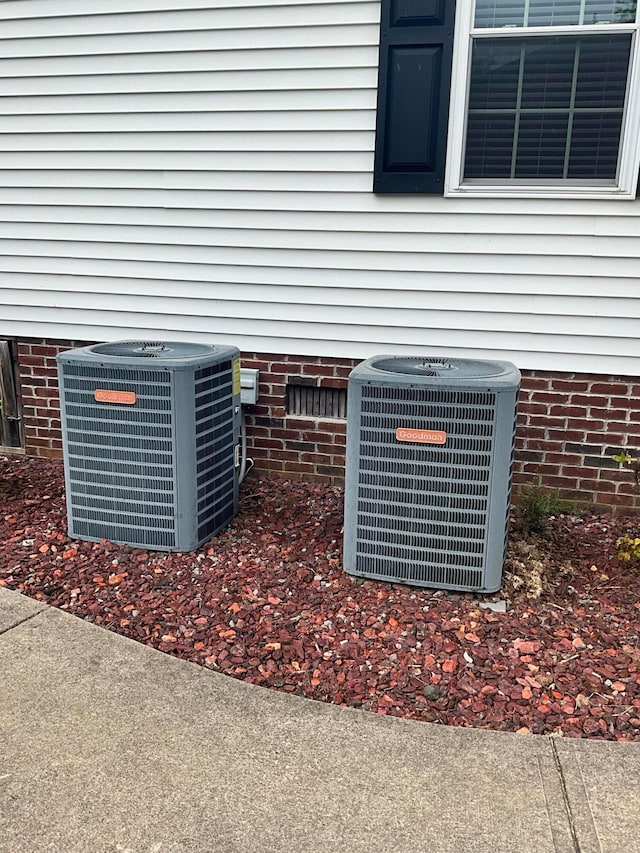 exterior details featuring central air condition unit and carpet flooring