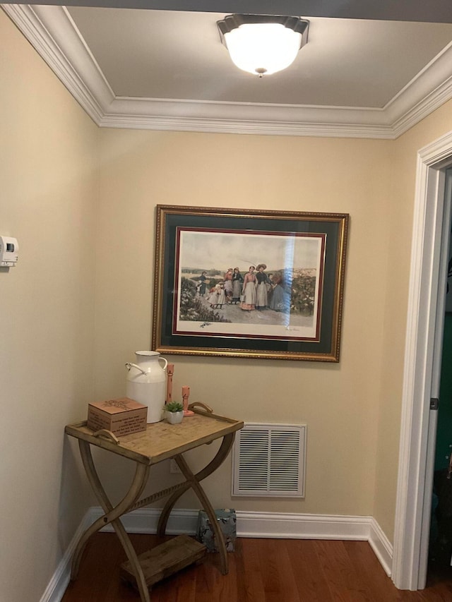 interior space featuring dark wood-type flooring and ornamental molding