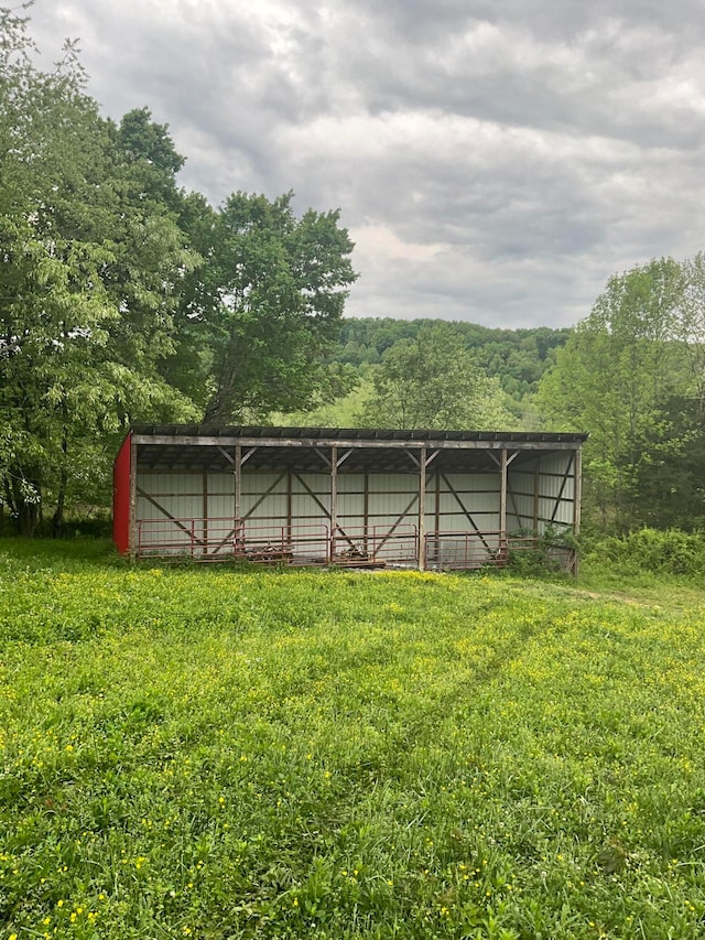 view of outbuilding with a lawn