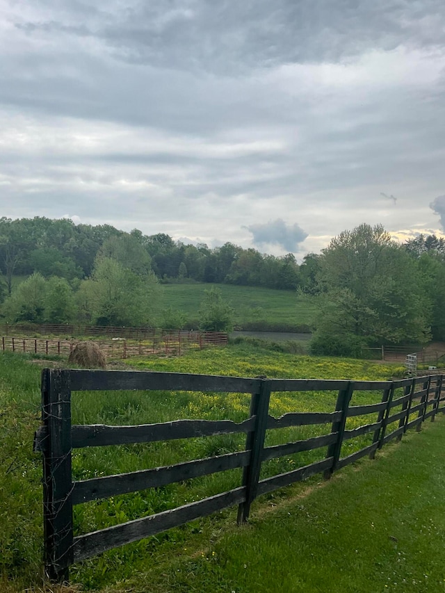 view of gate with a rural view